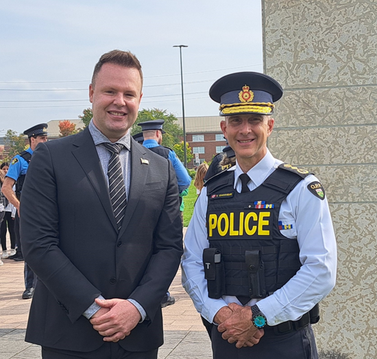 September 26, 2023: Ontario Provincial Police Commissioner Thomas Carrique (right), welcomes Interim Commissioner Carl Bouchard to the Franco-Ontarian Day flag-raising at OPP headquarters, Orillia.