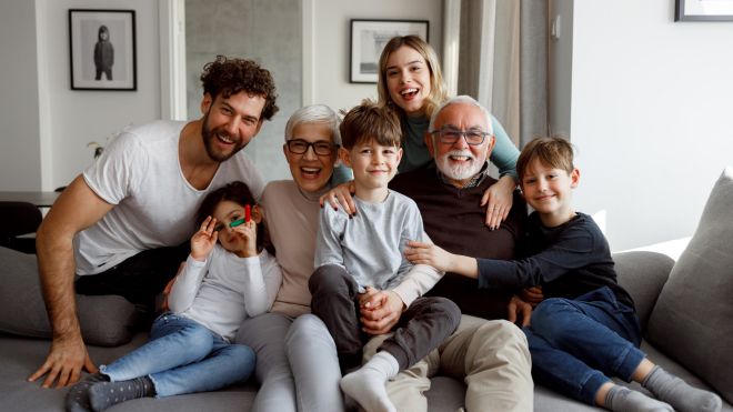 Multi-generational family sitting on a couch A multi-generational family sitting on a couch