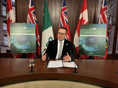 Commissioner giving a press conference at Queen's Park