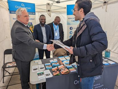 Ombudsman greeting visitors at Ombudsman Ontario booth at the City of Toronto’s Newcomer Day