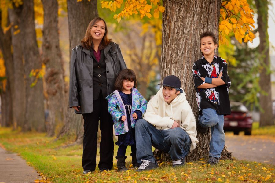 Family of four outside in a park