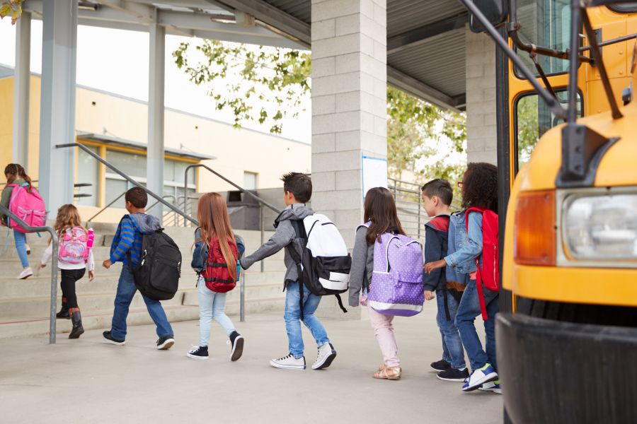 Group of children getting off a school bus