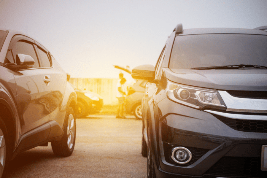 Two cars in a parking lot