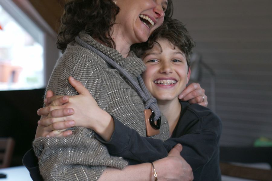 Adult hugging child An adult hugging a child